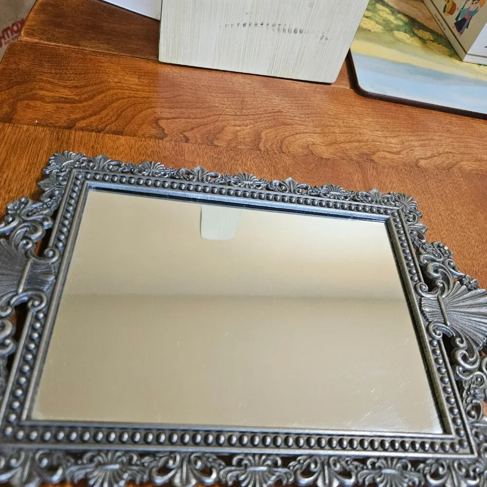 beautiful vintage ornate mirror has hook for hanging
